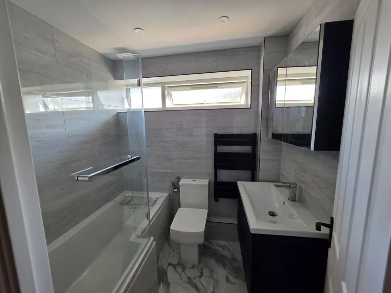 Grey-tiled family bathroom – Bathrooms