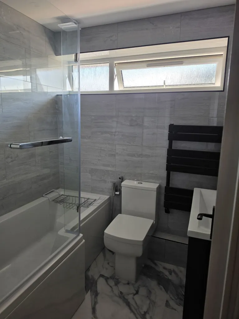 Grey-tiled family bathroom – Bathrooms