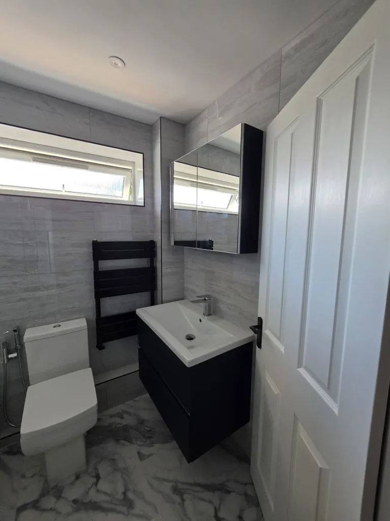 Grey-tiled family bathroom – Bathrooms