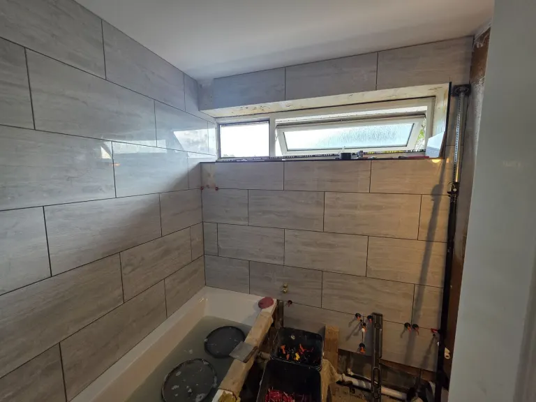 Grey-tiled family bathroom – Bathrooms