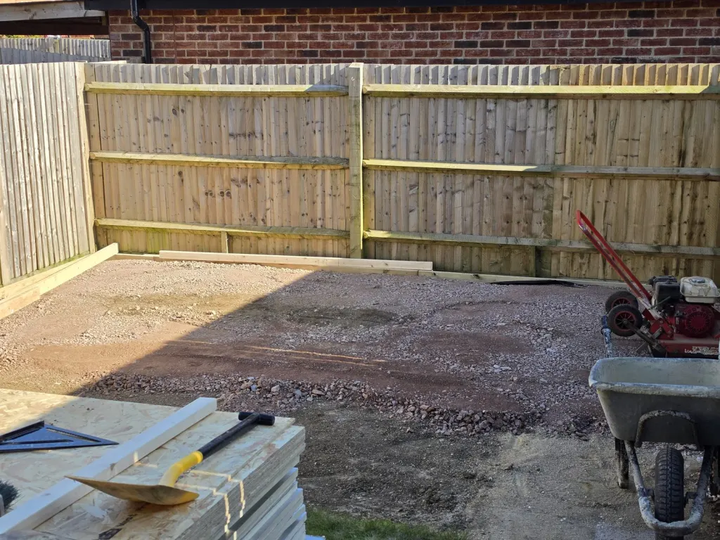 Before: Garden log cabin